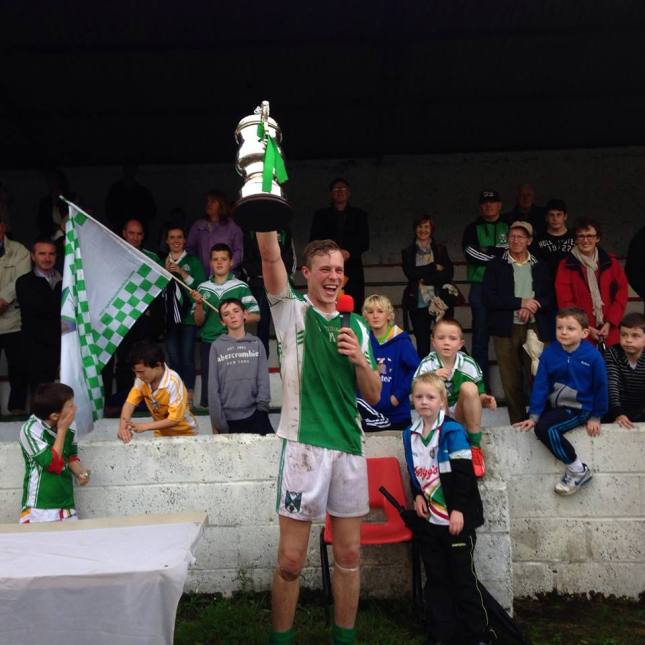 Geraldines captain Jim McEneaney holds aloft the Seamus Flood Cup after his side's win over St Brides
