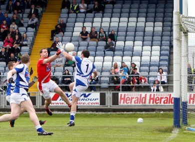 Shane Lennon fists past Laois goalkeeper Eoin Culleton in the Leinster Championship in 2013